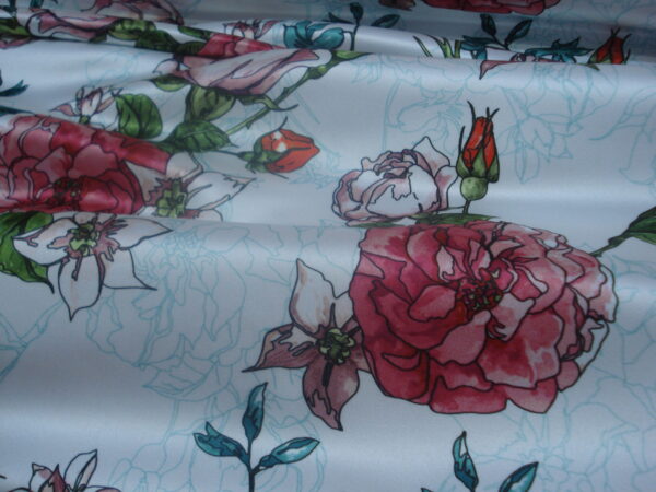 Tejido en raso f/blanco estampado flores "perfilado"