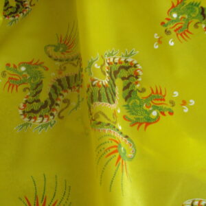 Tejido en rasete f/amarillo, dibujos dragones