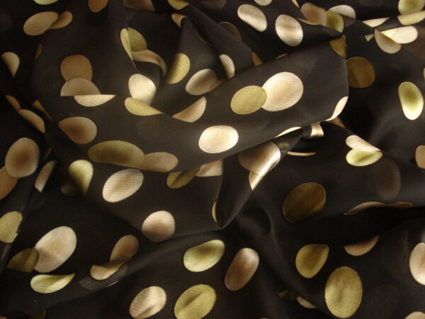 Tejido en gasa f/negro, estampado círculos ovalados verdes, beige