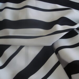 Tejido georgette en poliéster f/blanco y rayas negras gruesas y finas