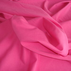 1,50mts. Tejido de punto  fino en algodón c/rosa chicle, ancho 1.52mts.