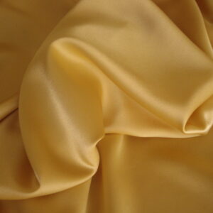 1,15mts. Tejido crepe de raso c/tostado, ancho 1.50mts.