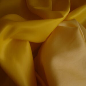 1,24mts. Tejido doble cara de raso en dos amarillos , ancho 1.52mts.