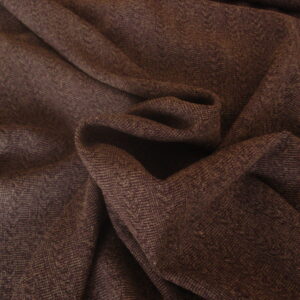 1,55mts. Tejido dibujo raya-trenzado c/ berenjena, ancho 1.48mts.