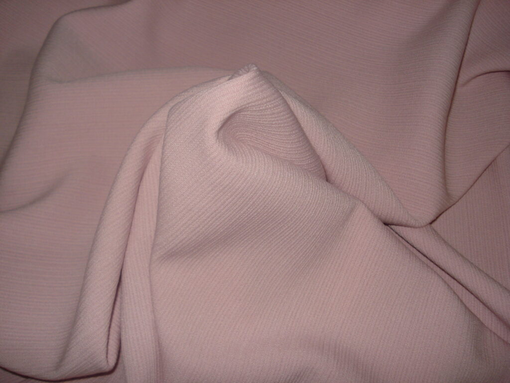 Tejido roma punto, ancho 1.48mts. c/rosa maquillaje
