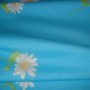 Tejido loneta f/azul claro c/dibujos margaritas, ancho 2,82mts.