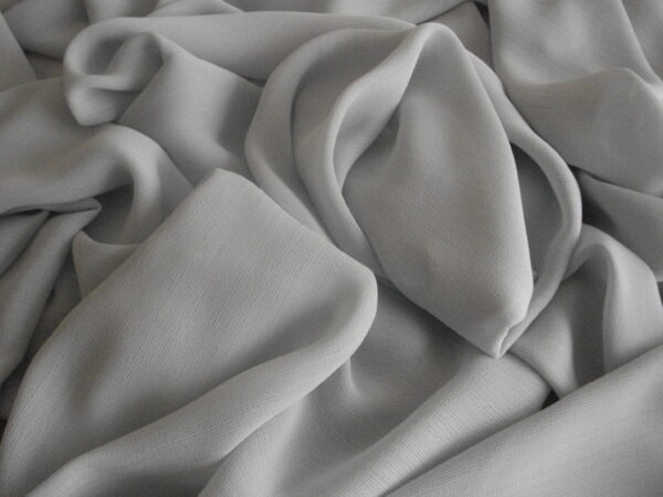 1,60mts. tejido gasa caída color azul grisaceo, ancho 1,50mts.