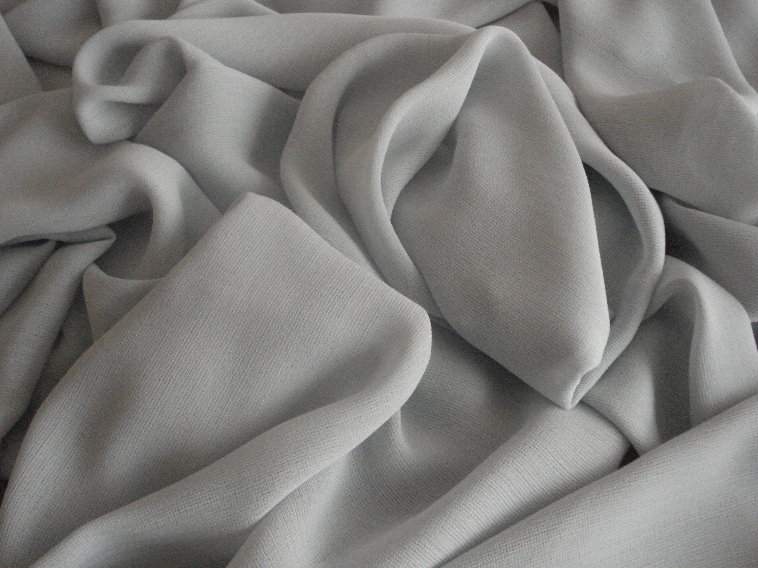 1,60mts. tejido gasa caída color azul grisaceo, ancho 1,50mts.