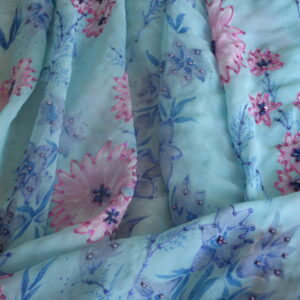 Tejido gasa f/azul estampado flores bordado y lentejuelas, ancho 1,15mts.