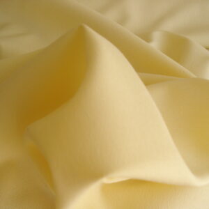 Tejido crepe c/amarillo mantequilla, ancho 1,50mts.