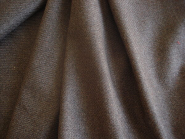 1,45mts. tejido jaspeado tonos marrones, ancho 1,52mts.