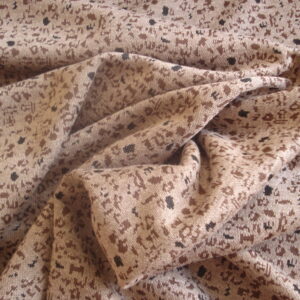 Tejido punto estampado abstracto c/fondo visón, ancho 1,65mts.