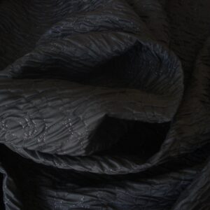 Tejido negro efecto acolchado c/ hilo lurex, ancho 1,30mts.